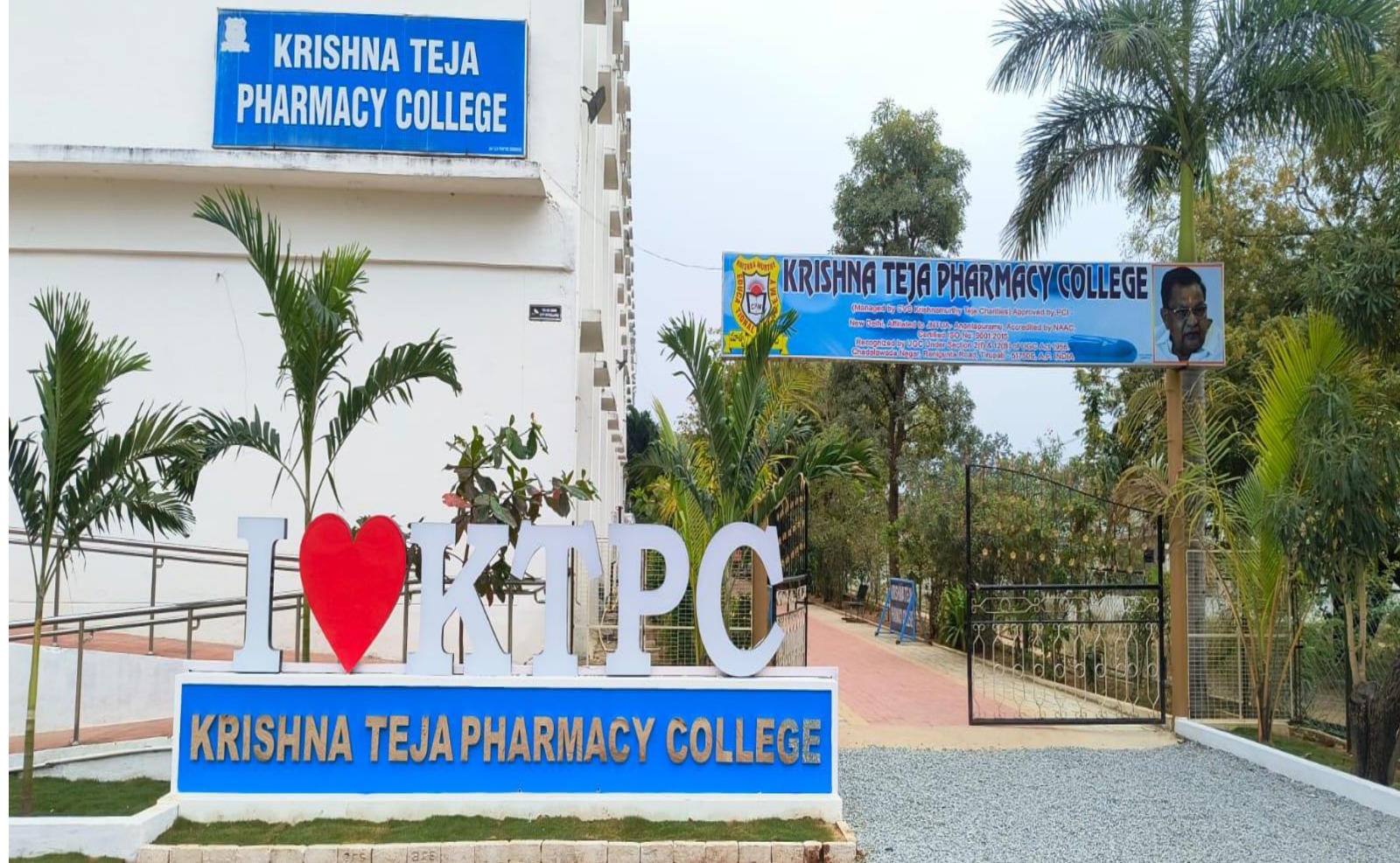 Pharmacy students and faculty outside a modern college campus